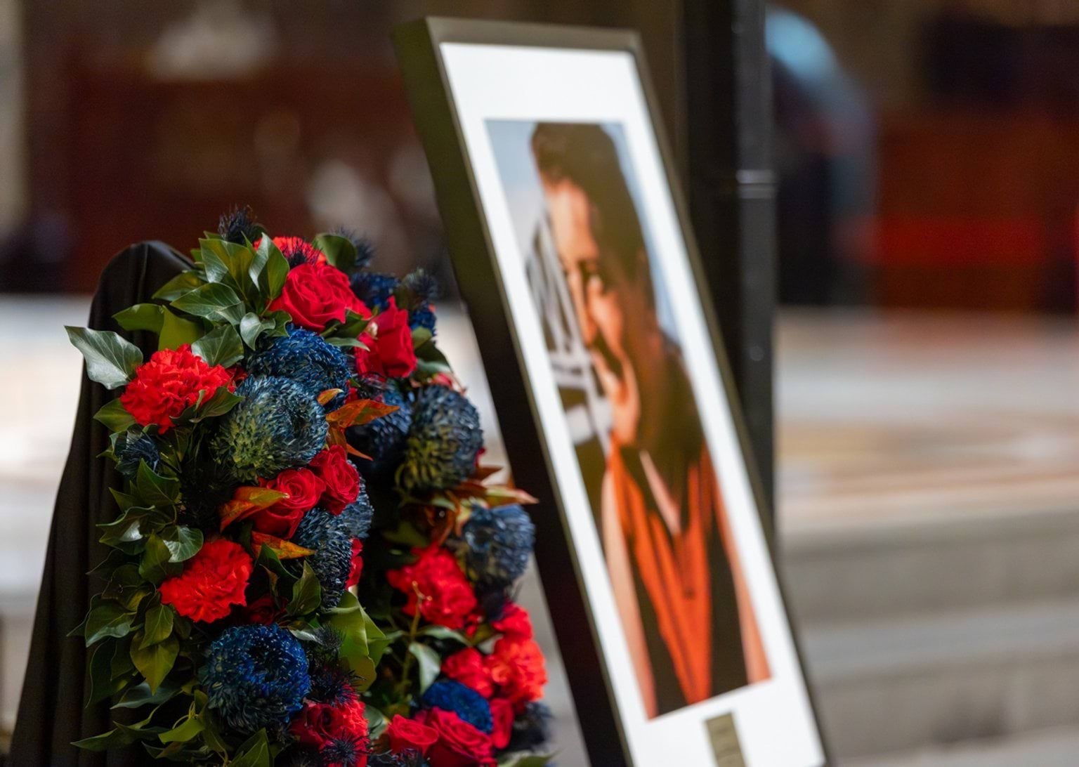 Flowers and portrait at altar at the State Funeral Service for The Hon Brian Dixon