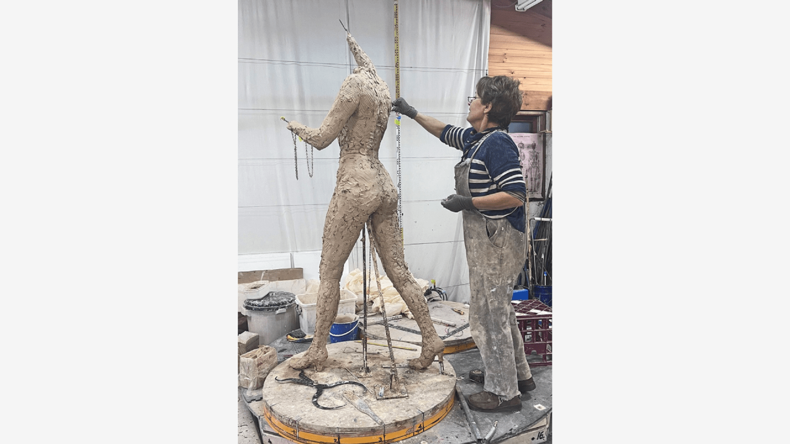 Barbara Rae statue - Lis Johnson armature and rough clay figure sculpting back