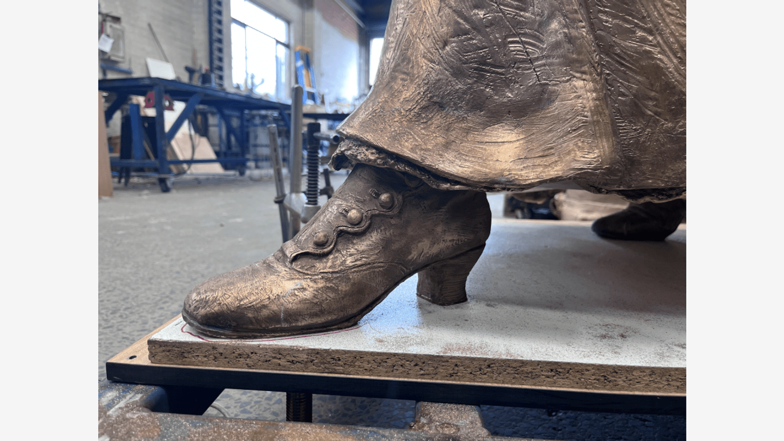 Barbara Rae sculpture bronze in foundry boot