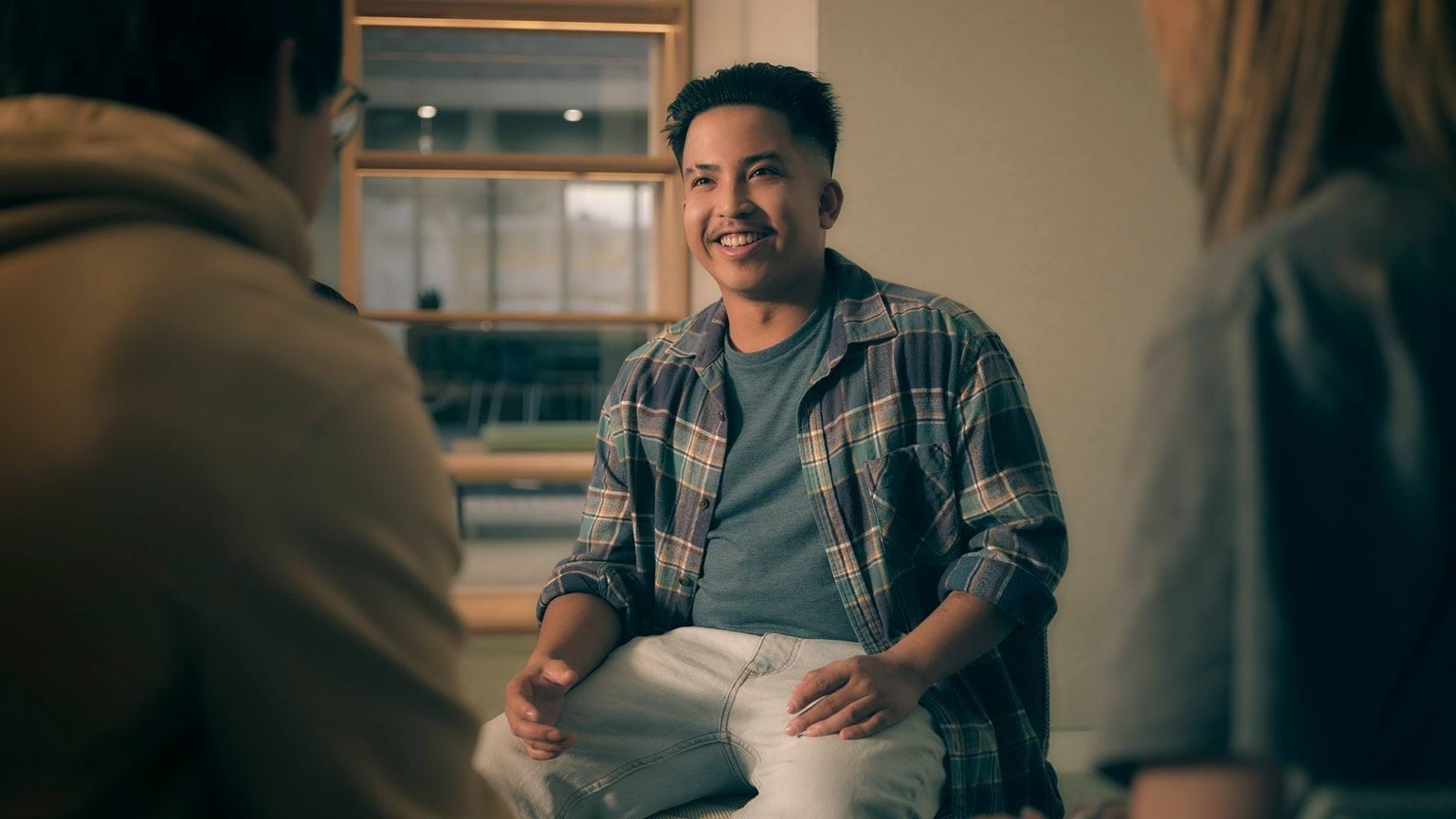 Nisha chatting to people in a group