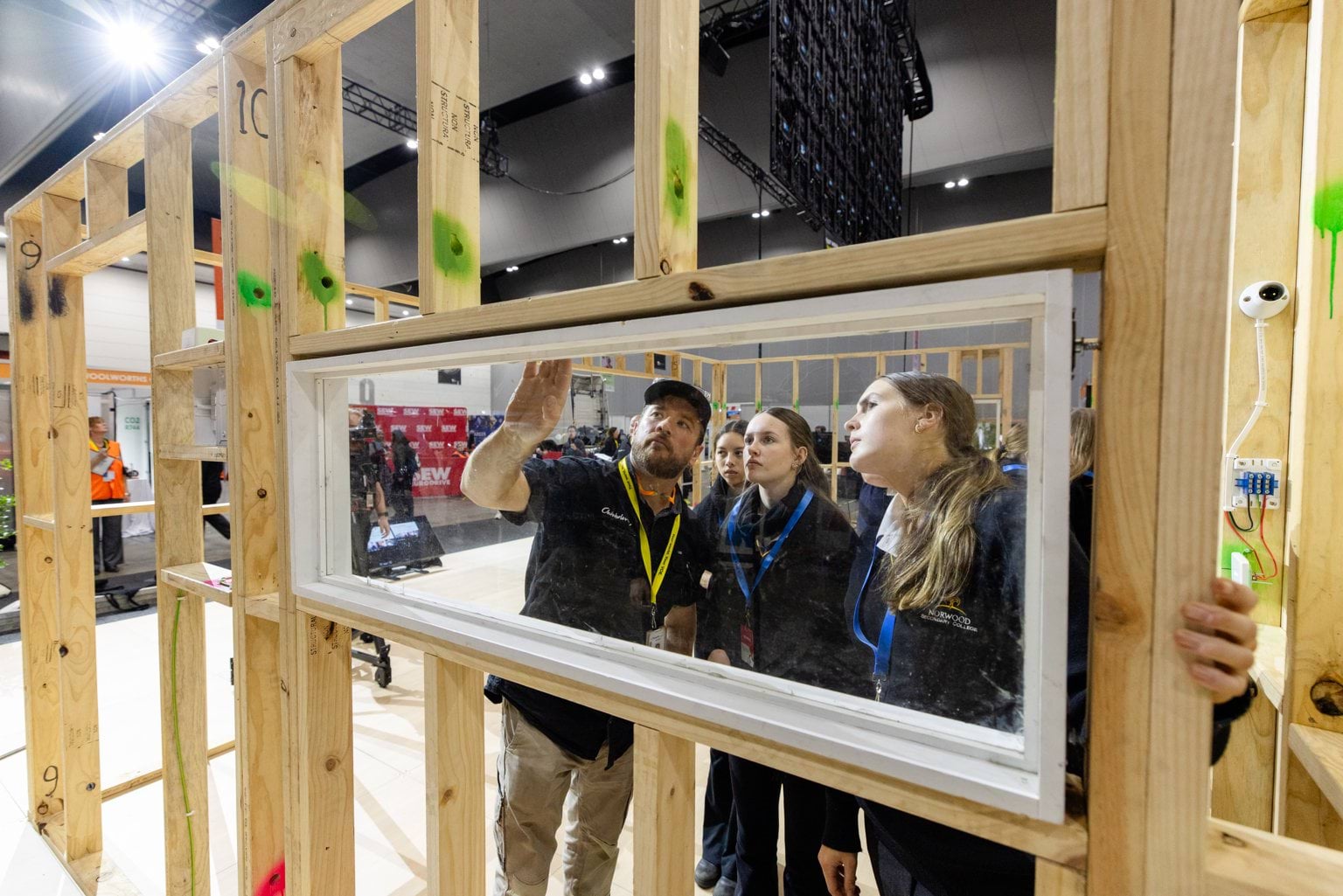 Female students learning about window frame insertion