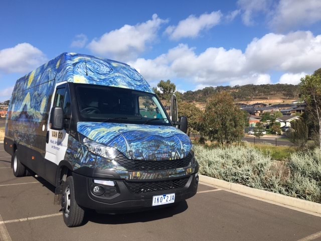 The Van Go mobile therapy bus parked on the side of the road in rural Victoria.