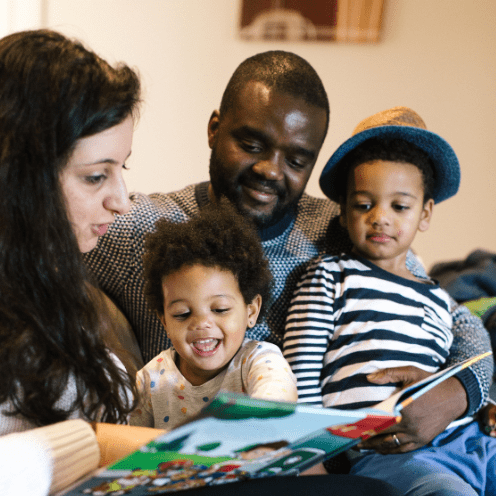 Family reading a book together