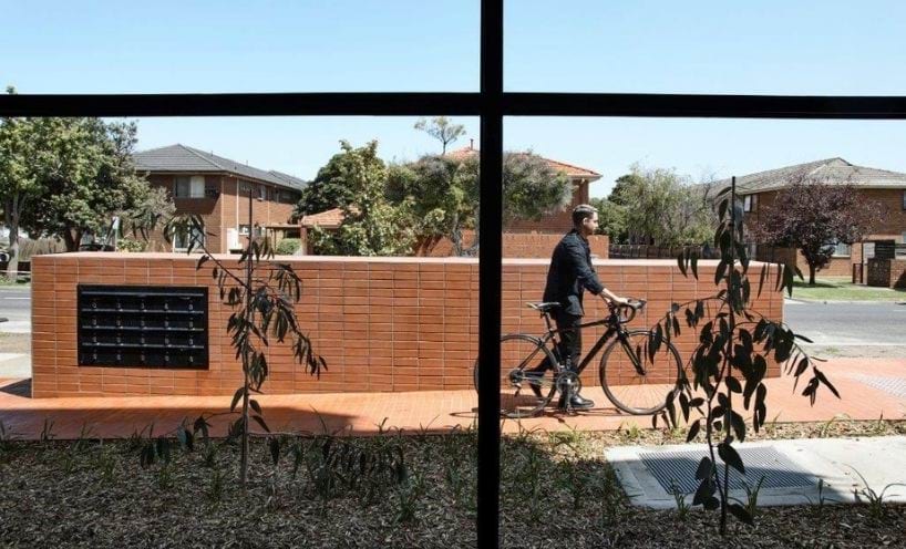 man with bike outside front window