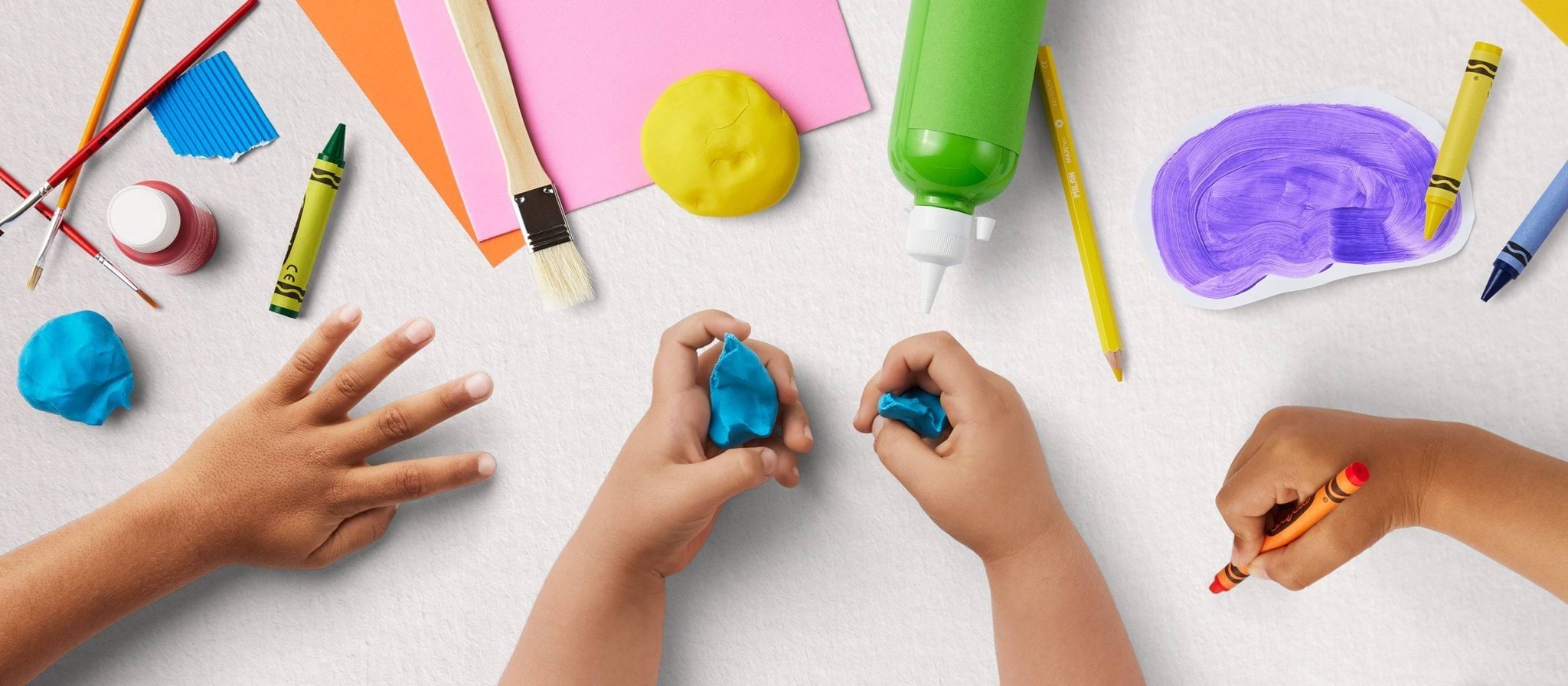 Kinder Tick Children colouring with crayons