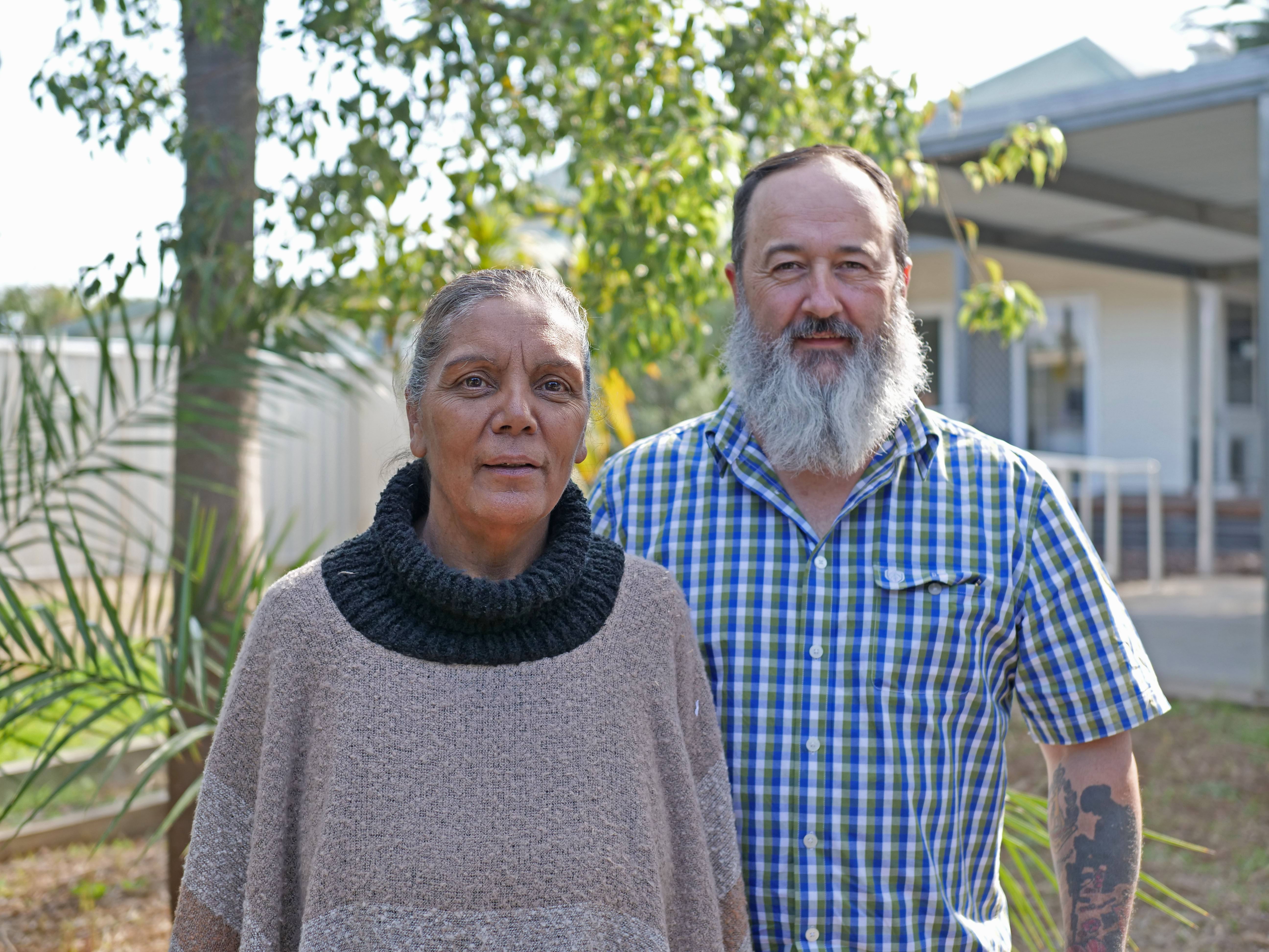 Aunty Aileen and Craig Hocking standing outside a community hall