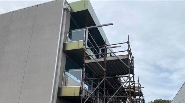 A low rise apartment building under construction. 