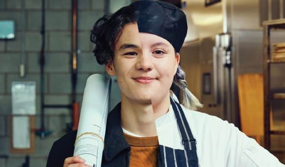 Two young people smiling at the camera. Only one half of each person displays so the image merges them into the shape of one person. One holds plans over their shoulder in a room with pipes on the wall, the other in a commercial kitchen