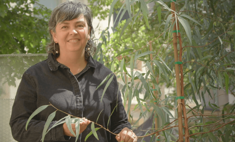 Picture of Zena Cumpston holding a native plant