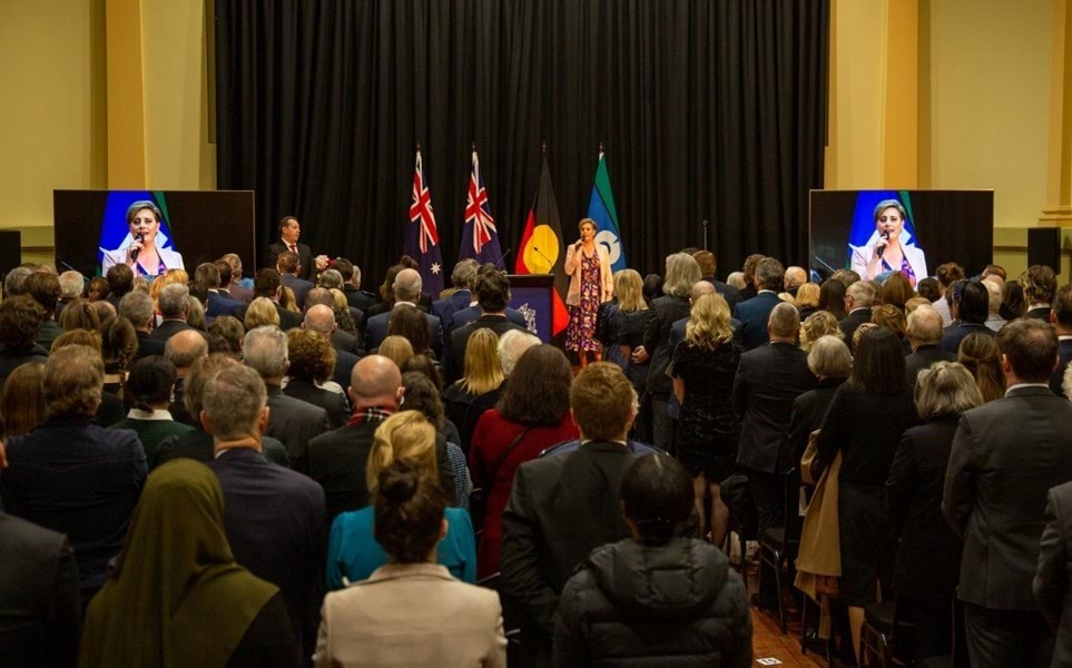 Ms Nina Ferro leading the Australian National Anthem.