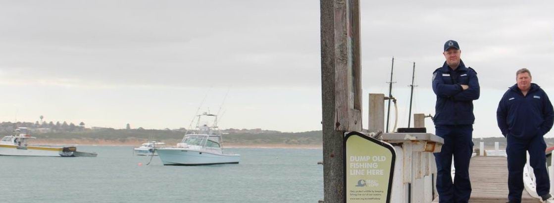 Image of officer standing on a jetty