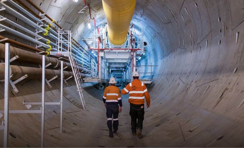 Two construction workers in tunnel construction site