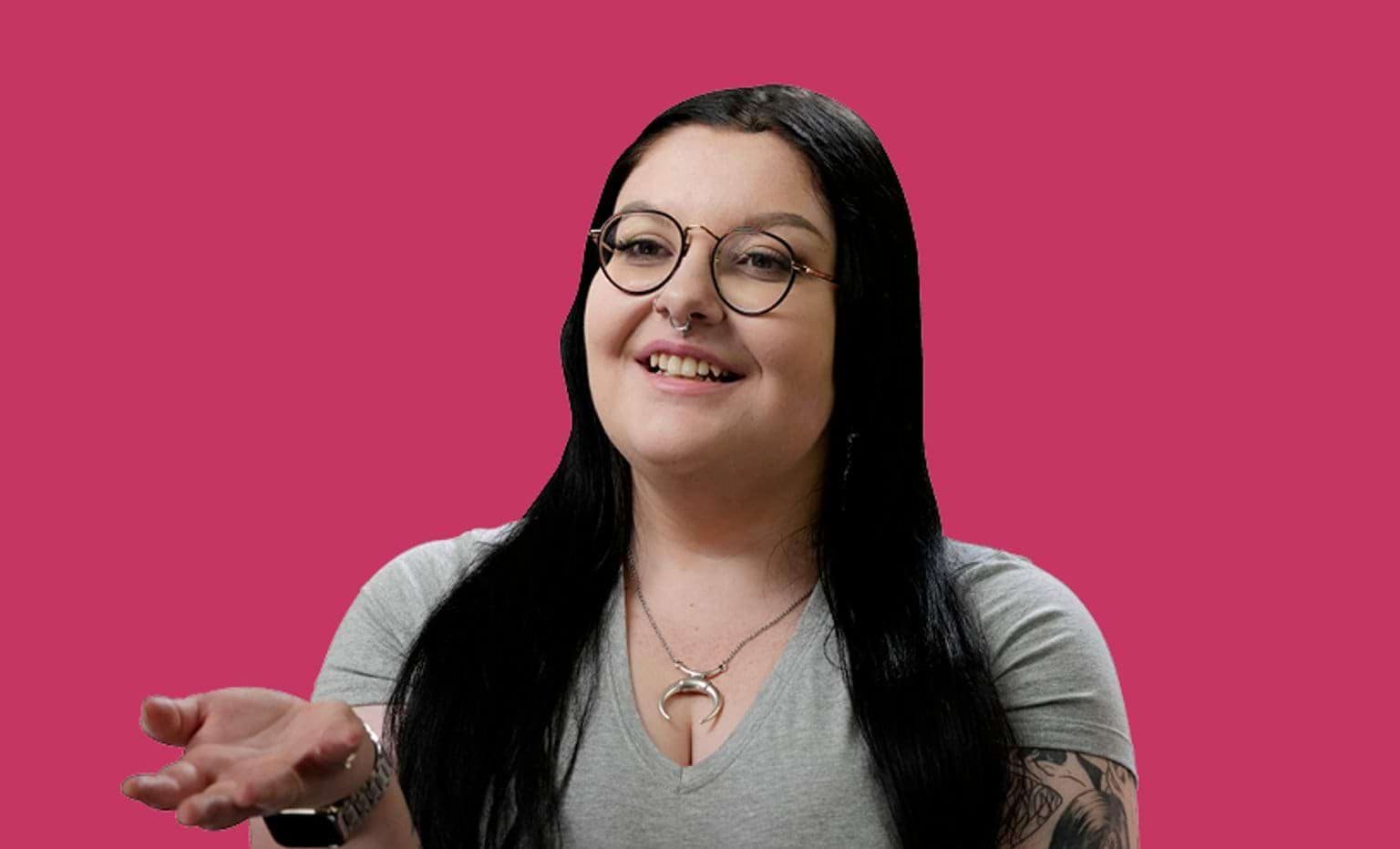 Image of female graduate in front of pink background