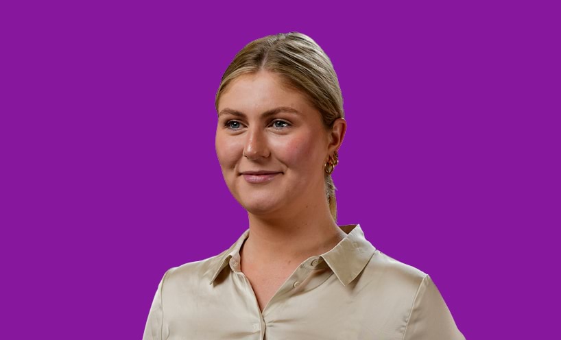 Image of graduate with purple background behind