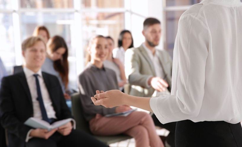 Person presenting to indoor training session