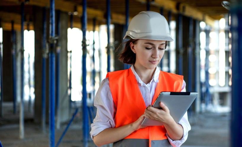 Woman in high-vis on a construction site