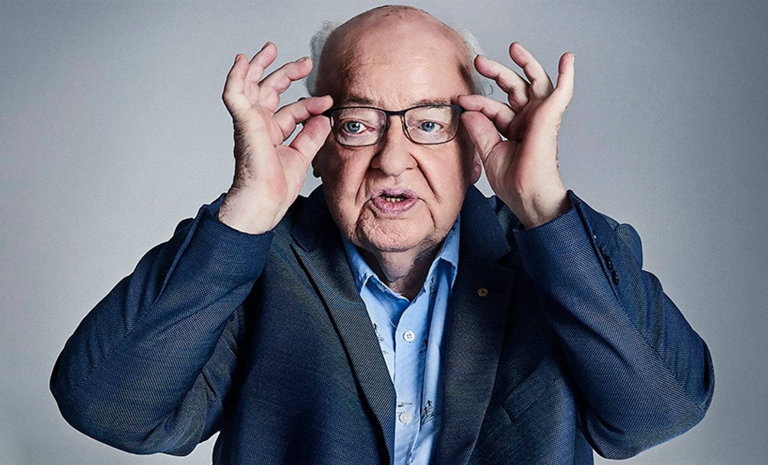 Father Robert (Bob) John Maguire AM RFD Father Bob Maguire AM RFD adjusts his glasses