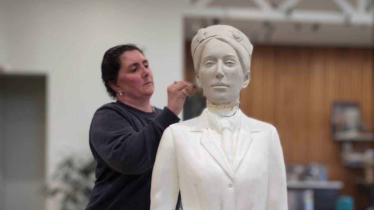 Artist Lucy McEachern working on the sculpture of Dr Vera Scantlebury Brown OBE in the studio.