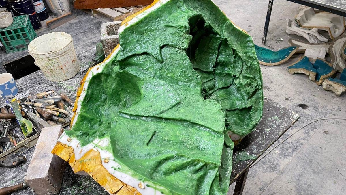 A large piece of the plaster moulding is laid carefully aside before the bronze casting is made. The inside of the mould is coated with a silicone solution to aid in the casting process. The plaster layer is about 10 cm thick.