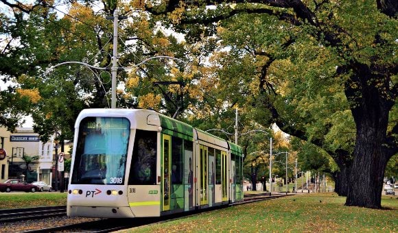 A photo of a tram travelling along Victoria Street in Melbourne.