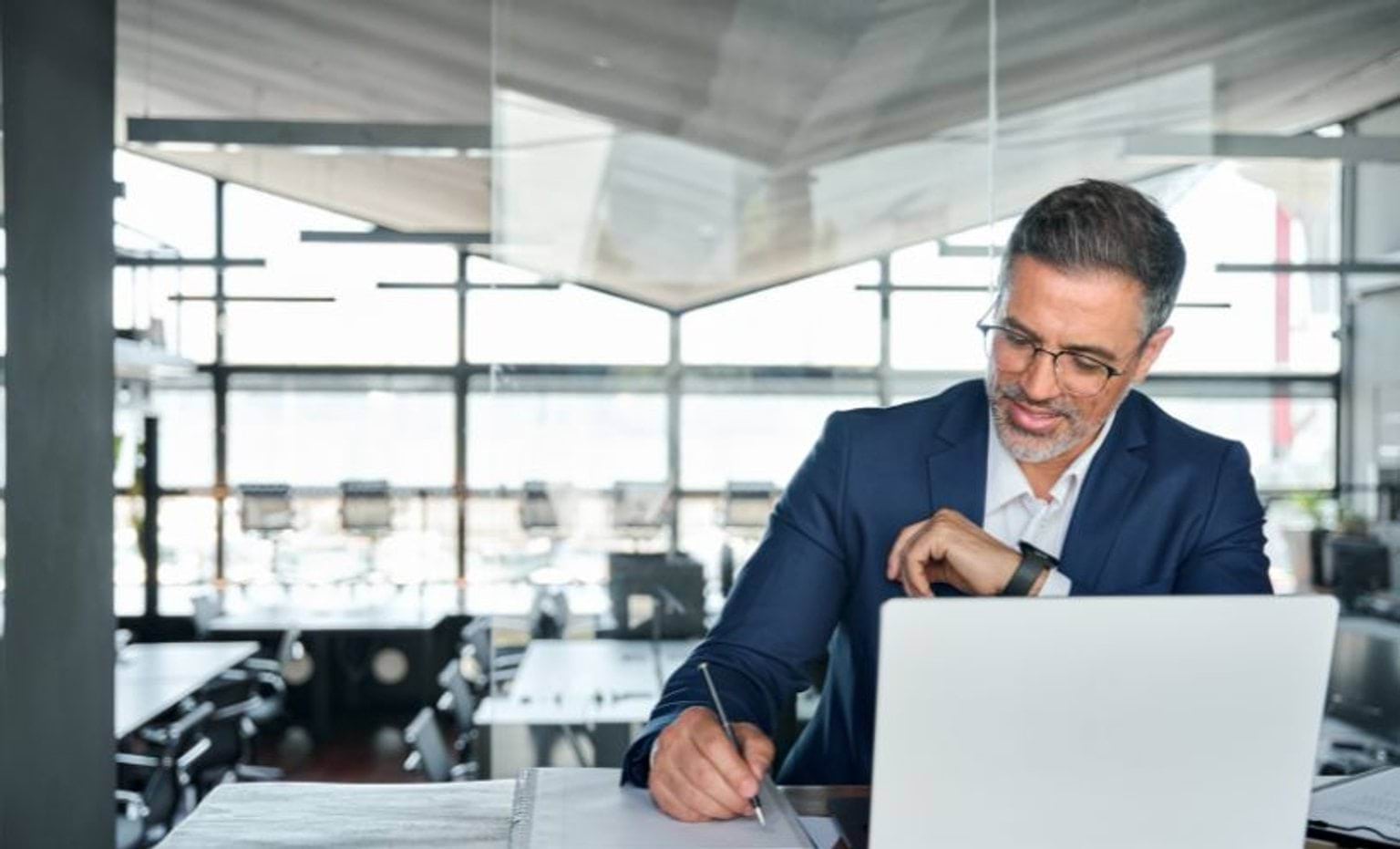 Person in an office using a laptop Person in an office using a laptop