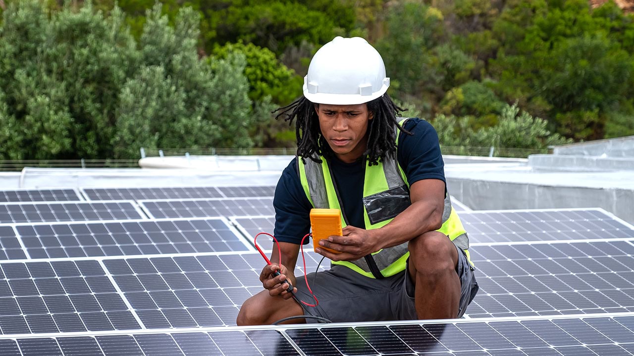 Electrician working on solar panels