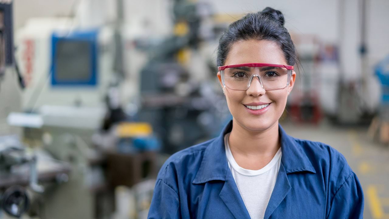 Female apprentice looking at camera