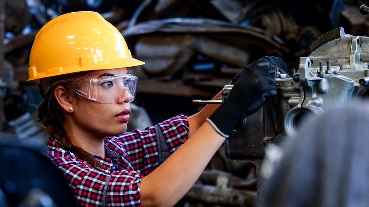 Person wearing working on a machine