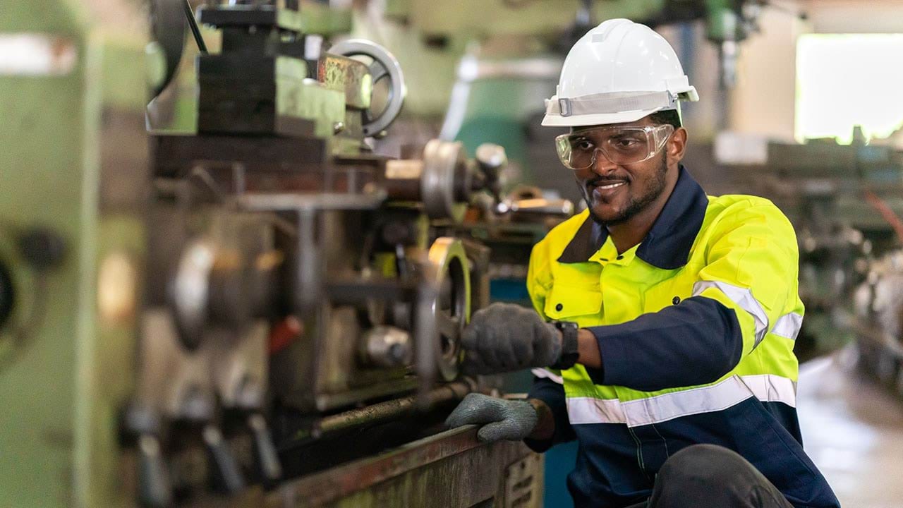 Person working on metal fabrication machine