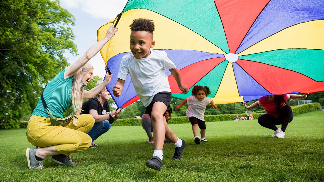 Out of school hours care worker with children