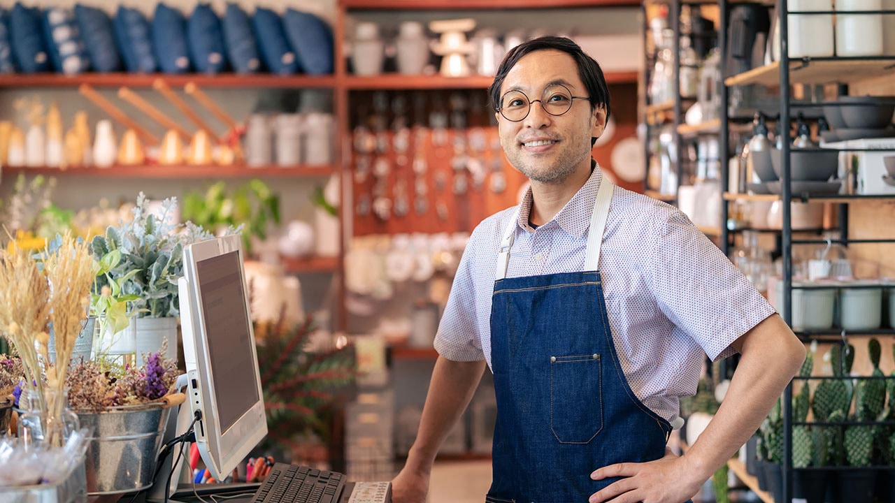 Retail worker at point of sale register