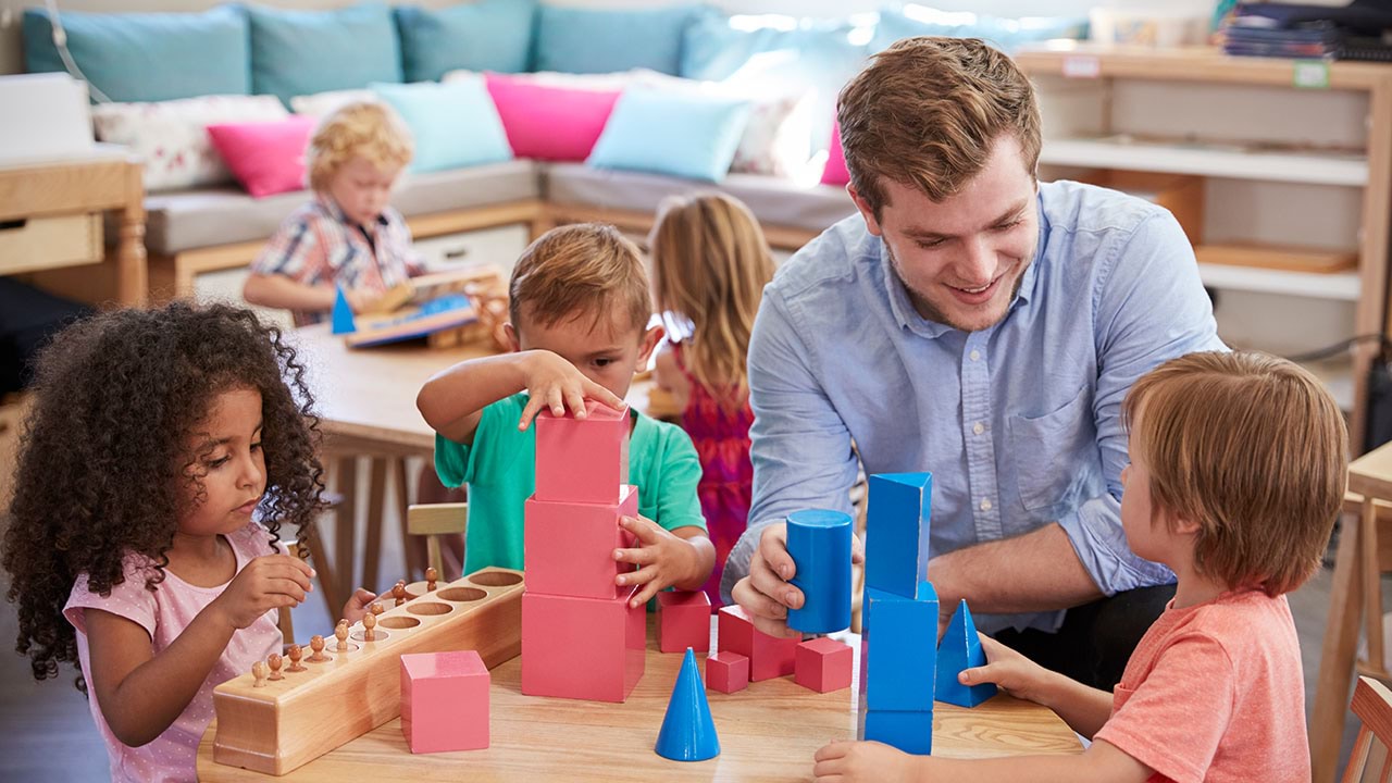 Pre-school educator with young children