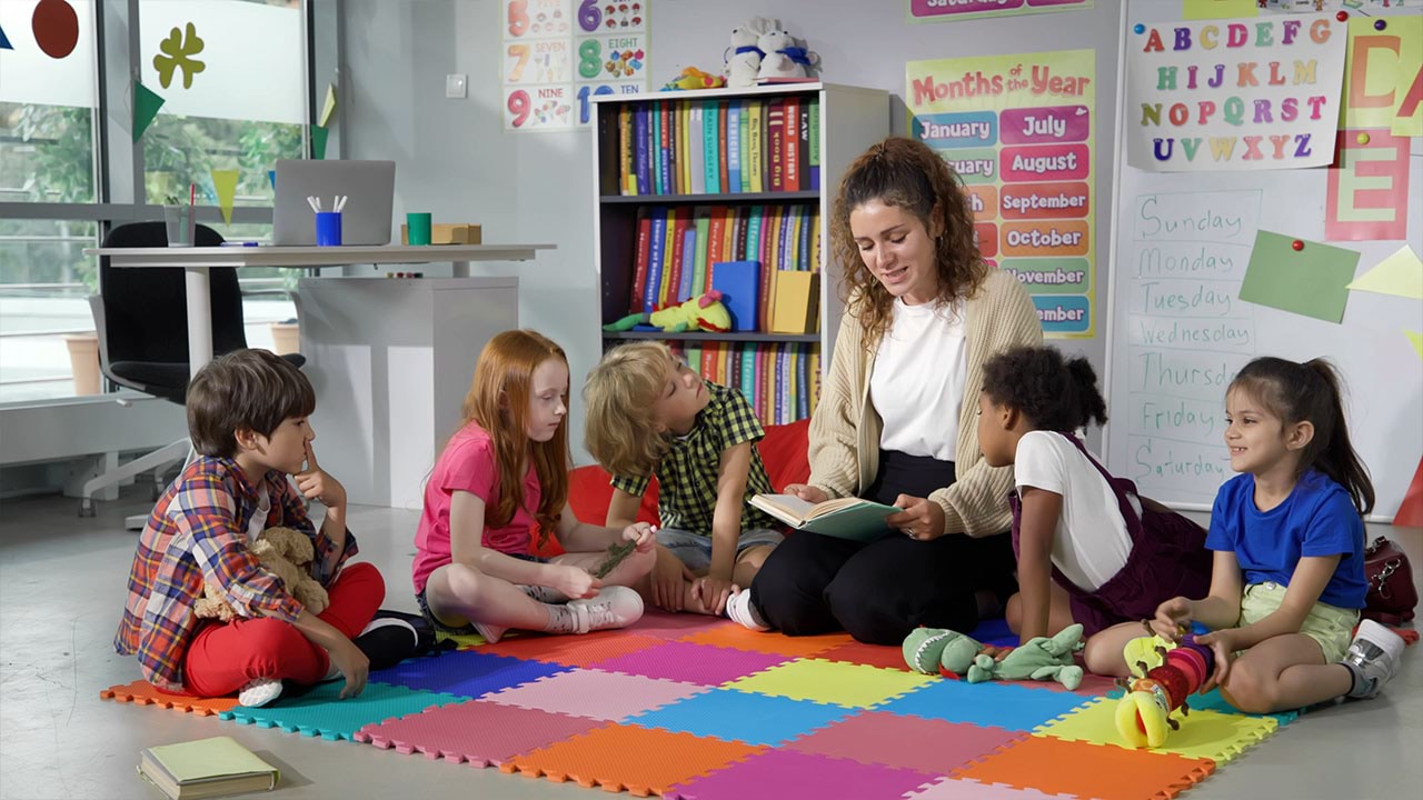 Educator reading to a group of children