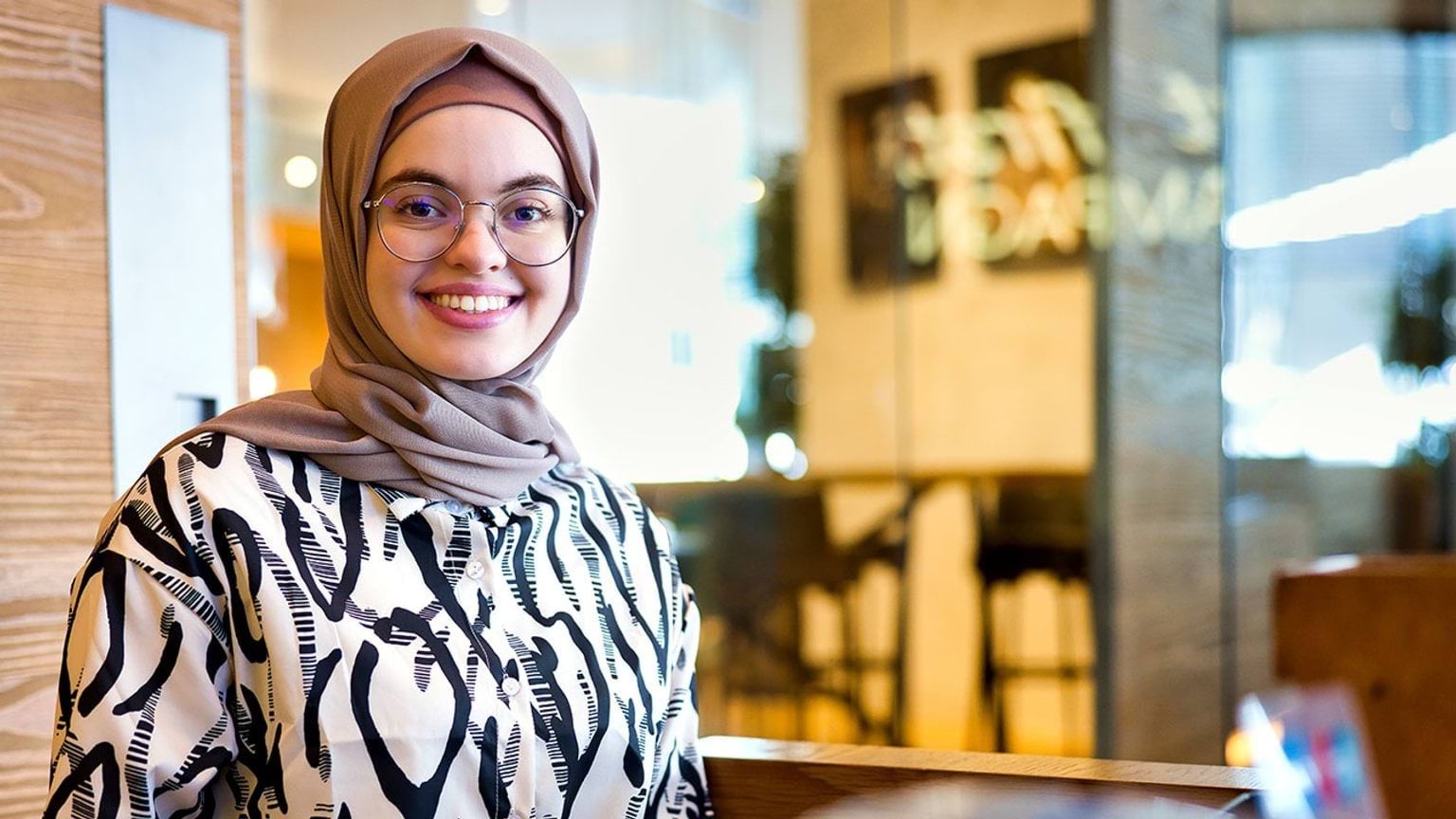 person working at reception counter