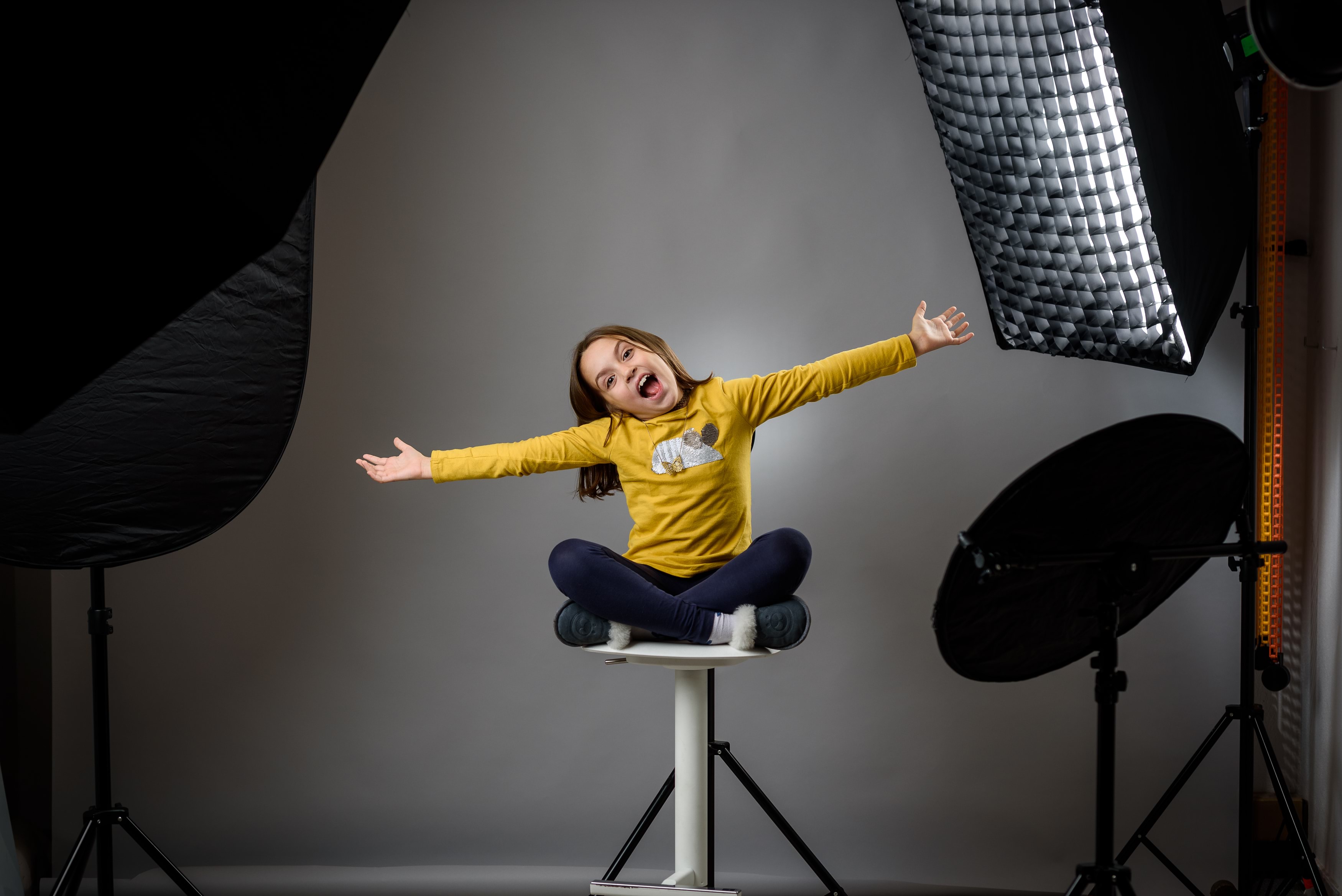 Child posing in photo shoot