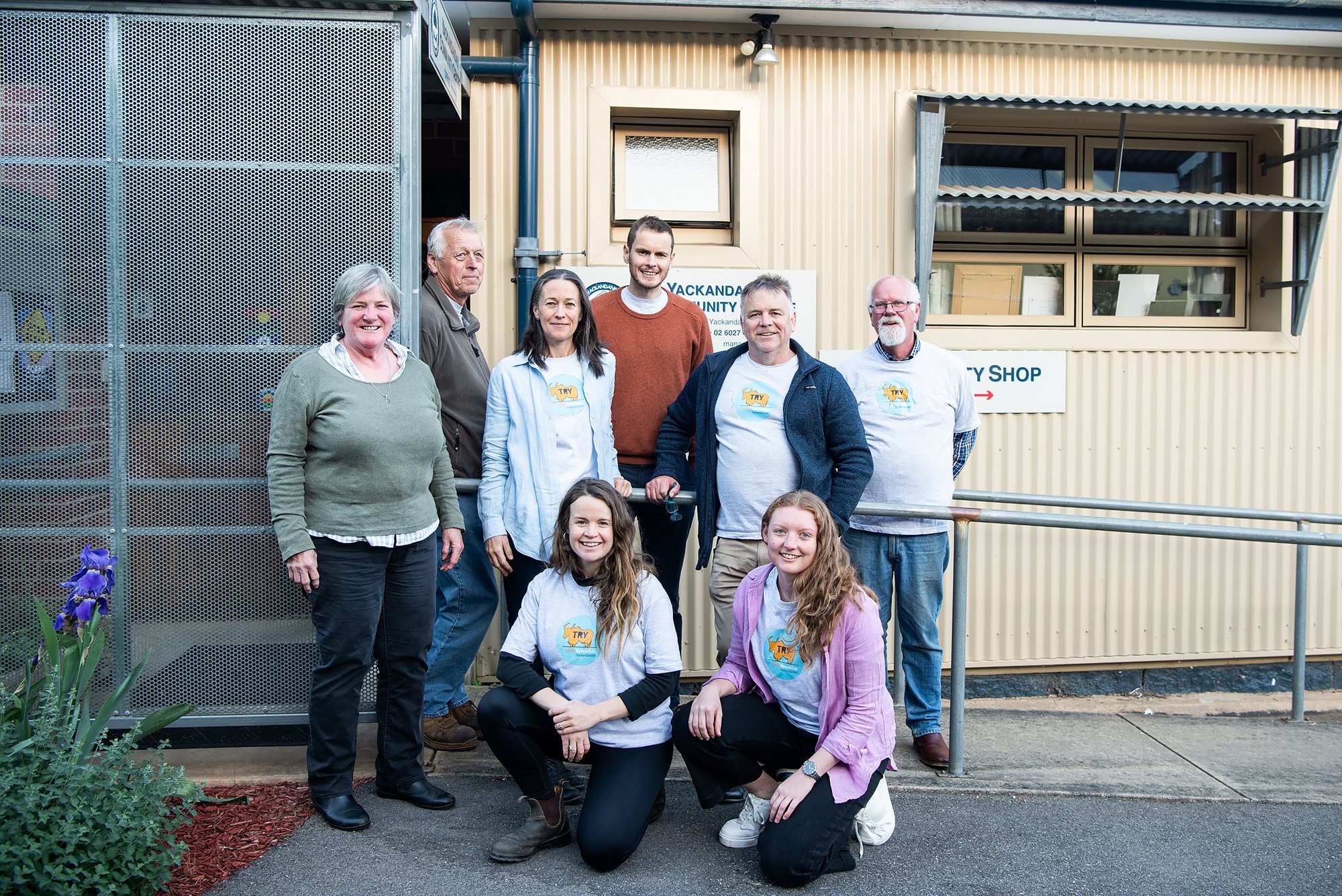 Totally Renewable Yackandandah team members standing in front of the community centre for a group photo