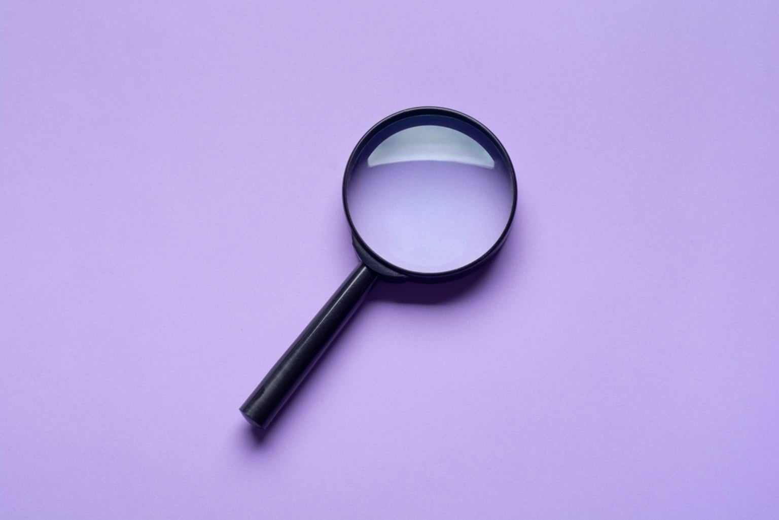 Back to search Magnifying glass on purple background