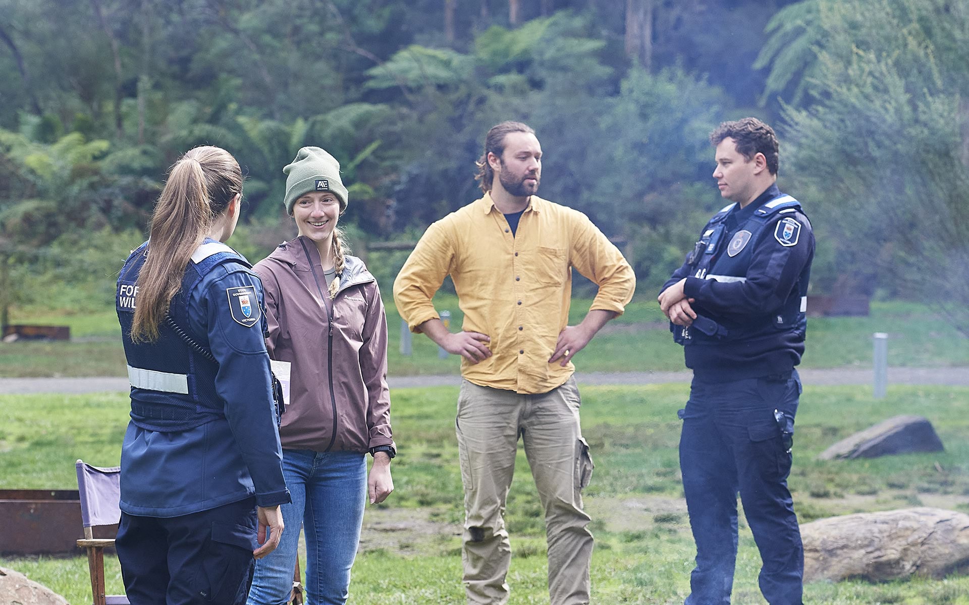 Authorised officers on patrol chatting with campers