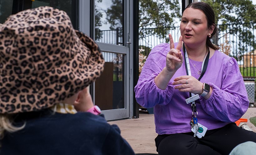 Educator having a conversation with a child.