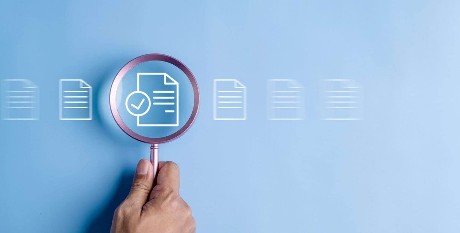 Regulator Resource Magnifying glass on an image of a document