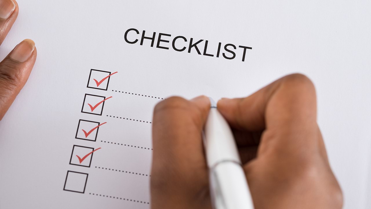 A person ticking off items on a check list