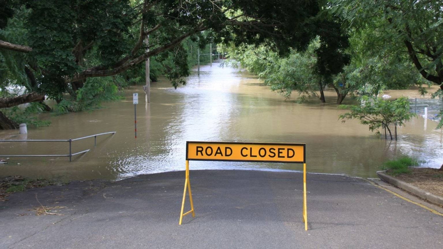 Road closed sign on a flooded street Road closed sign on a flooded street