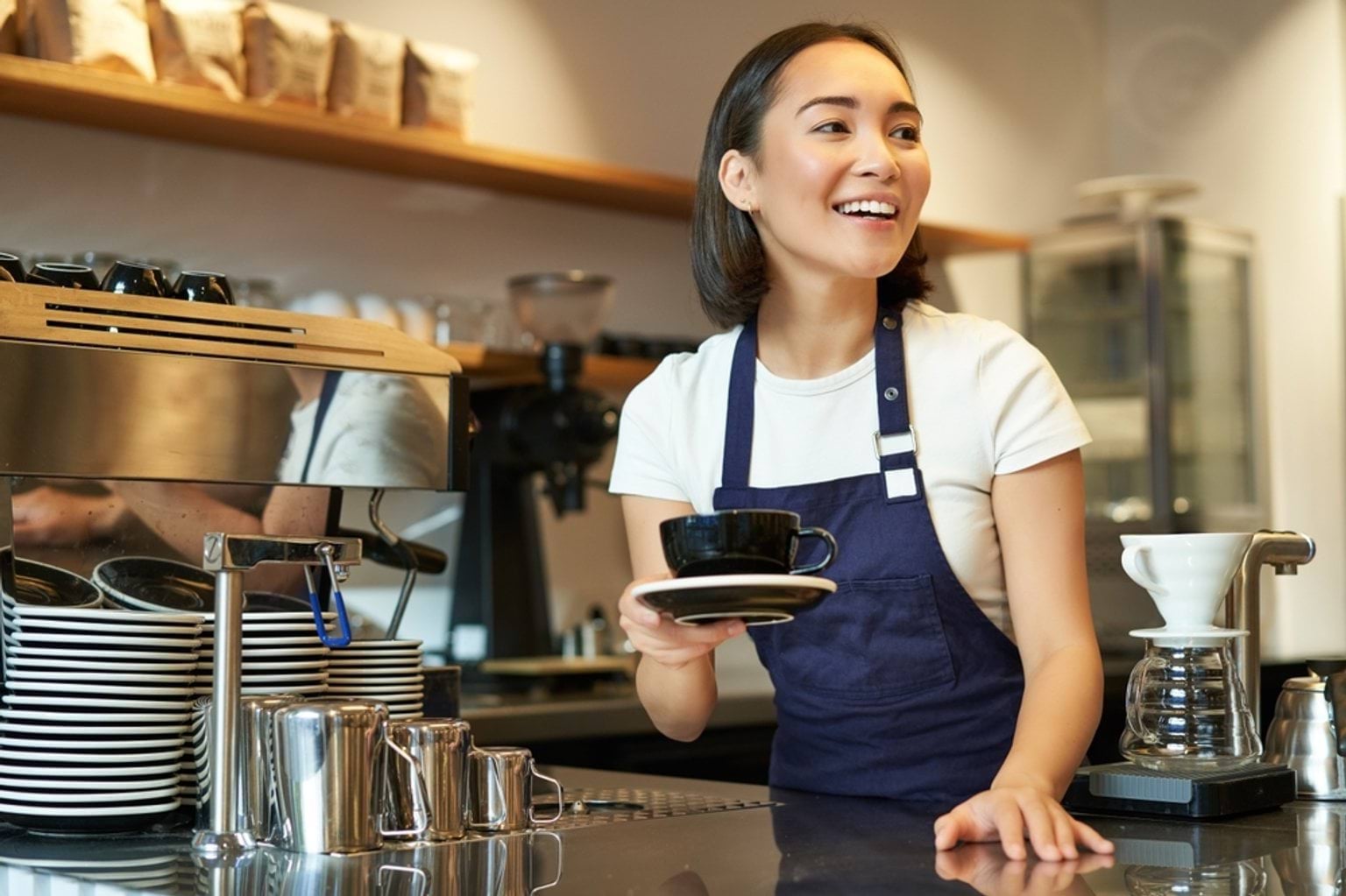 Improving Industry Experience Someone serving coffee