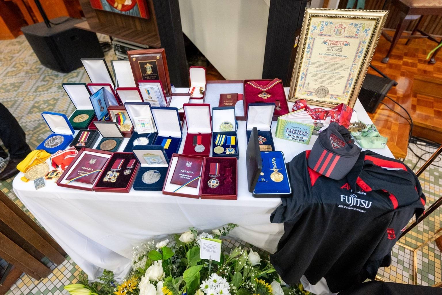 Medals displayed on a table at State Funeral Service for Stefan Romaniw OAM