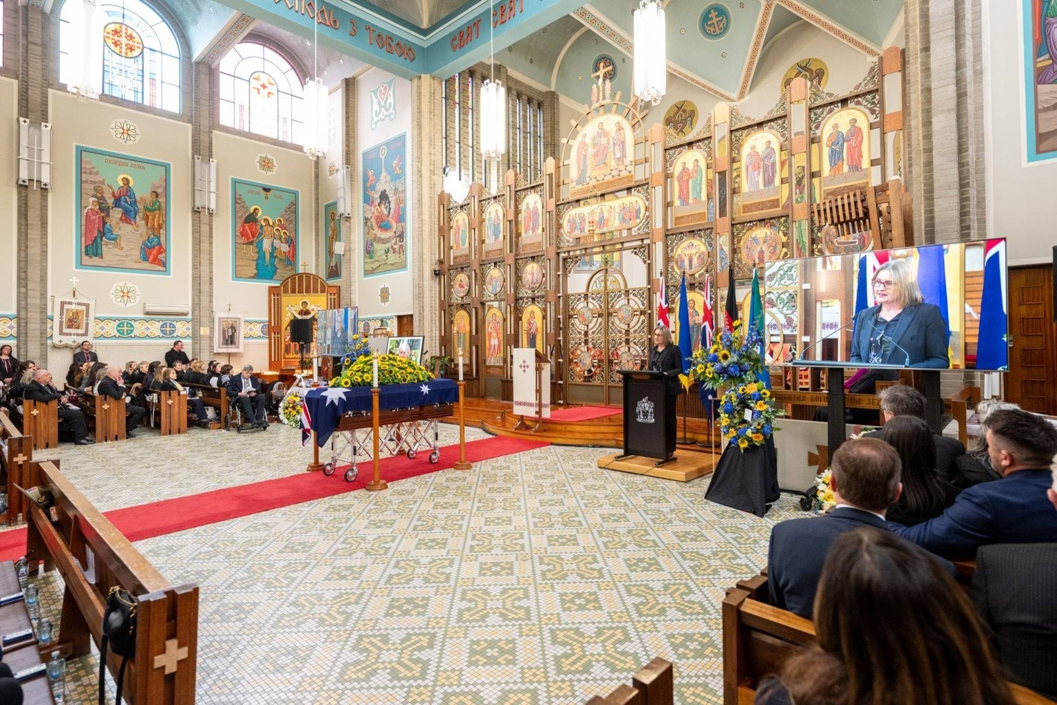 Casket and attendees at State Funeral Service for Stefan Romaniw OAM