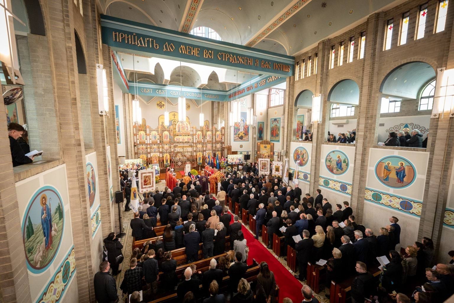 Attendees standing inside Sts Peter and Paul Ukrainian Catholic Cathedral for State Funeral Service for Stefan Romaniw OAM